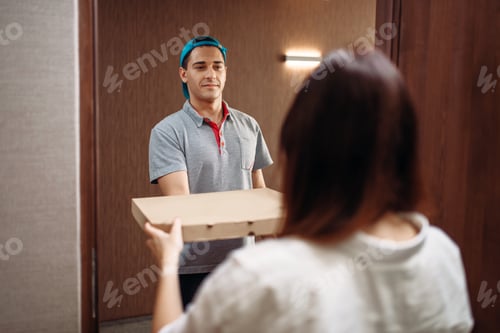 Preview: Pizza delivery boy gives box to female customer