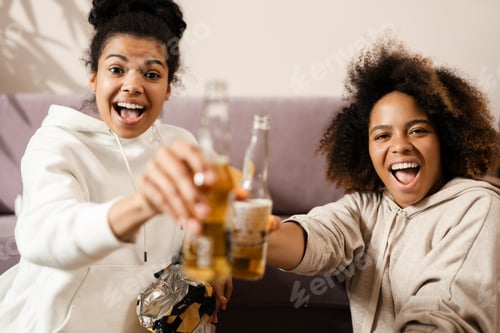 Preview: Two happy young african women friends