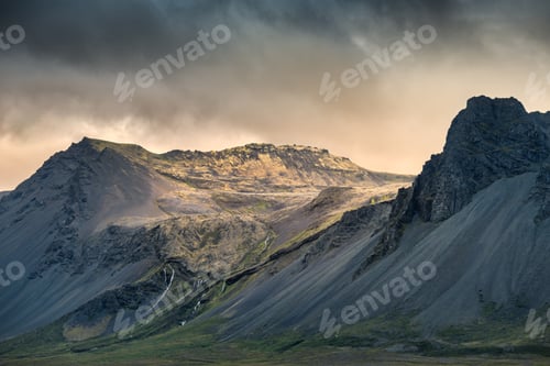 Preview: Dramatic mountain landscape under cloudy sky