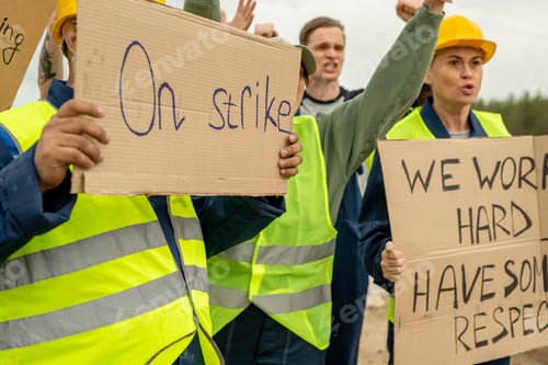 Preview: Group of angry builders or miners with placards