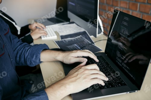 Preview: partnerships developing programming and coding technologies working on laptop