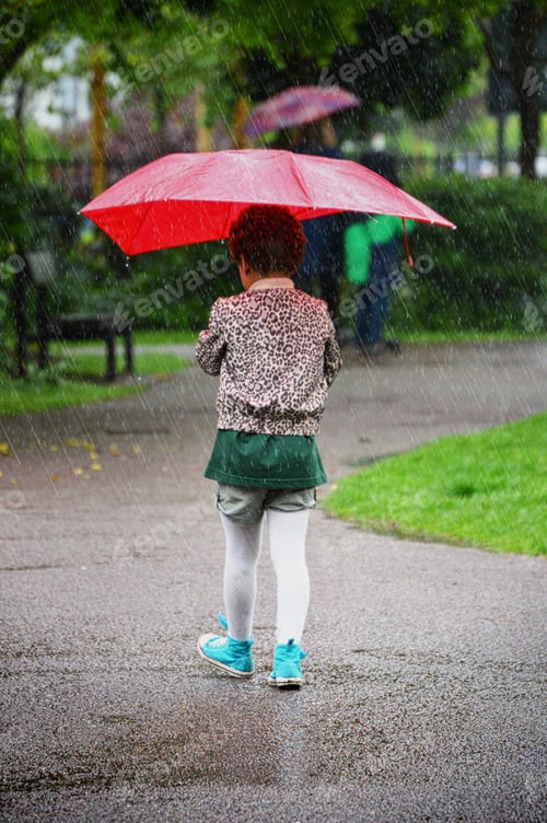 Preview: Girl and red umbrella in the rain