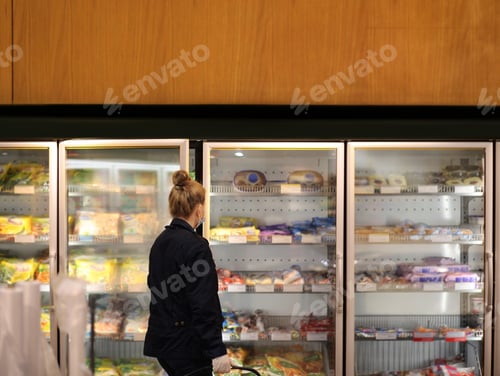 Preview: Supermarket Shopping, Face Mask And Gloves,Woman Choosing Frozen Food From A Supermarket Freezer
