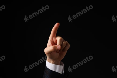 Preview: Businessman's hand close-up on a black background