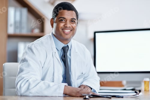 Preview: Come talk to me about your healthcare needs. Portrait of a young doctor working in his office.