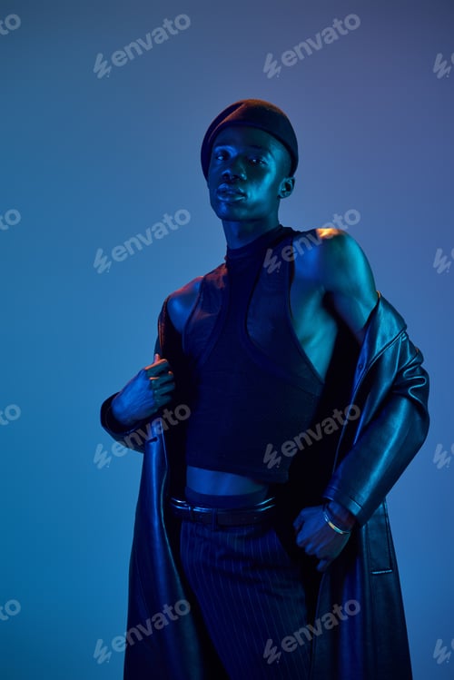Preview: Stylish expression of youth with vibrant colors lighting the way for a confident young man