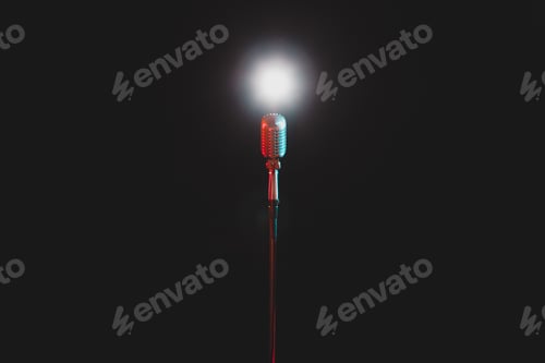 Preview: retro microphone on a black background in the center of the frame.
