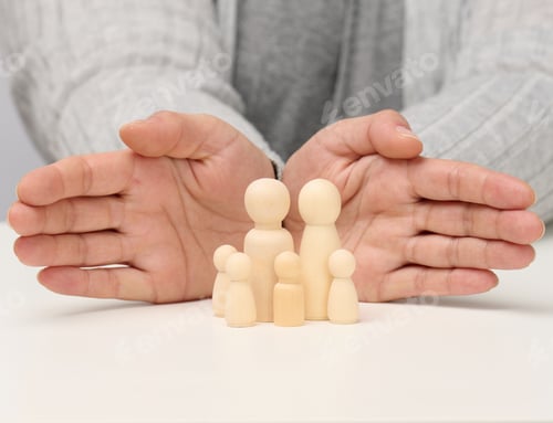 Preview: Wooden figurines of men, a family guarded by two female hands. Help, life insurance, safety