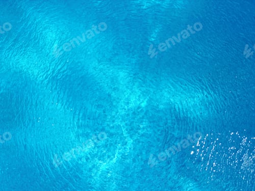 Preview: Closeup shot of water surface texture against a blue background