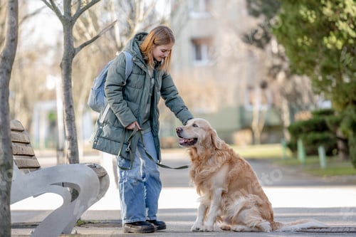 Preview: Little Girl In Green Jacket Walking With Golden Retriever On Early Spring Street