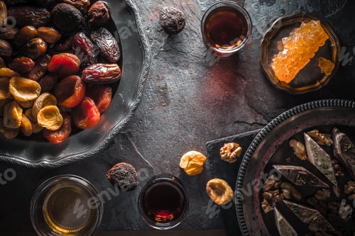 Preview: Dried fruits, grape sugar and tea on gray slate free space