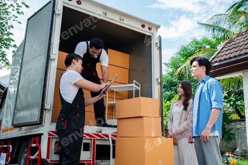 Preview: Asian Couple check while unloading boxes and furniture from a pickup truck