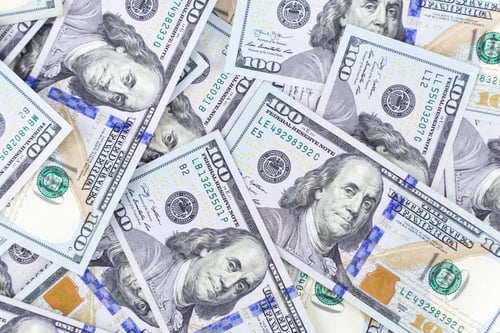 Preview: top view of dollars scattered on the desk