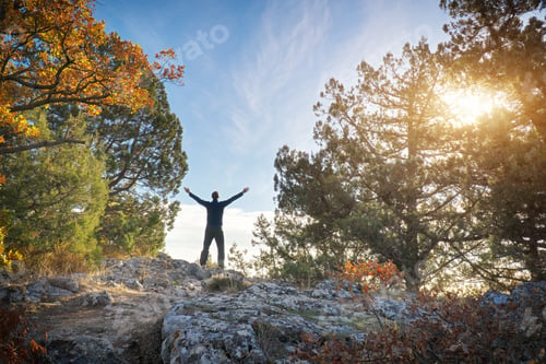 Preview: Man strive hands on the mountain edge.
