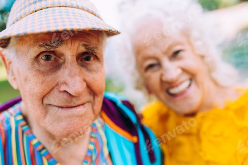 Preview: old modern couple dressing fashionable colored clothes