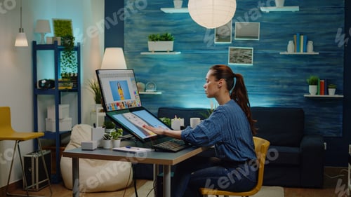 Preview: Retouch artist using editing software for pictures at studio