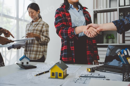 Preview: engineering team shaking hands start planning for architecture Engineer sketching construction proje