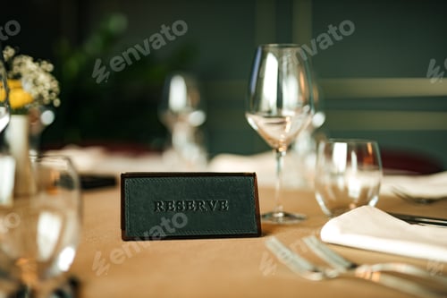 Preview: Reserve sign on the table in restaurant.