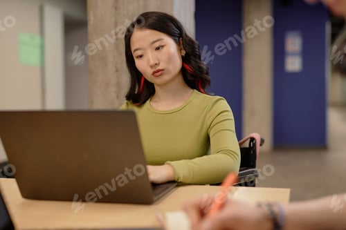 Preview: Confident College Girl Working on Computer in Class