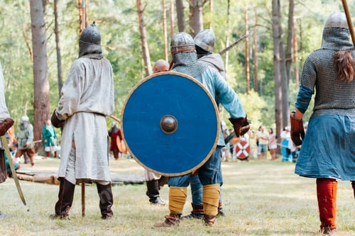 Preview: Armed vikings standing on the battlefield outdoors. Festival of medieval culture and lifestyle