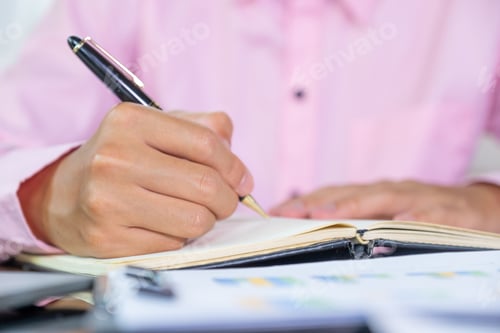 Preview: Businessmen bookkeeper hand holding pen doing account for paying tax in working office
