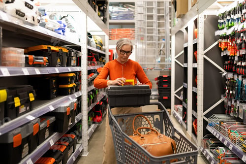 Preview: Person shops for tools and household items in a hardware store during the day while pushing a cart