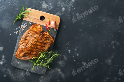 Preview: Raw steak t-bone or porterhouse. Steak t-bone or porterhouse in sauce with spices, salt and rosemary
