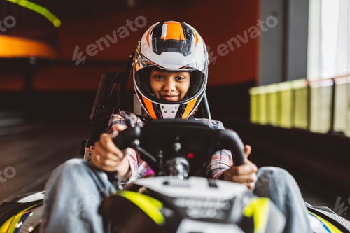 Preview: Go-Kart Racers Drive african woman driving with helmet