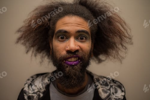 Preview: Portrait of man with wild hair and purple lipstick