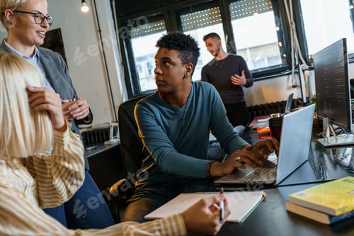 Preview: Group of casual team workers and programmers working on a new project