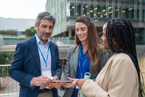 Preview: Business people networking at outdoor conference meeting