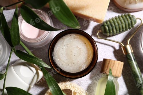 Vista previa: Flat lay composition with different body care products on light textured table