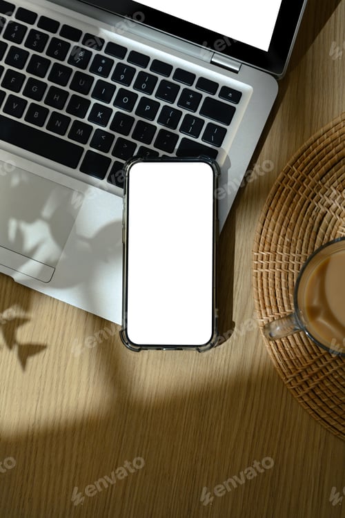 Preview: Flat lay of smartphone with blank screen on wooden table with coffee cup and soft sunlight shadows