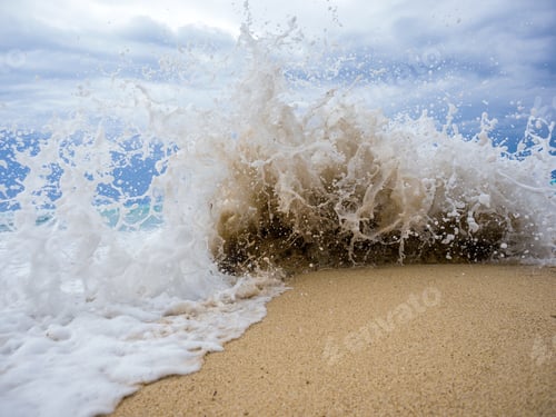 Preview: waves breaking on a stony beach