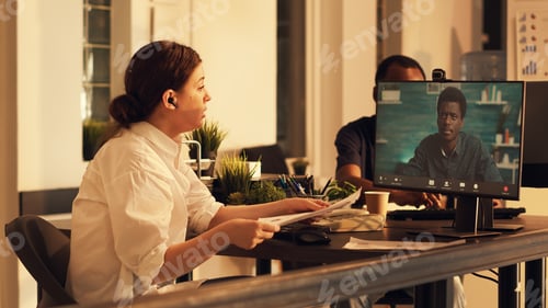 Preview: Freelancer talking to african american man on online videocall