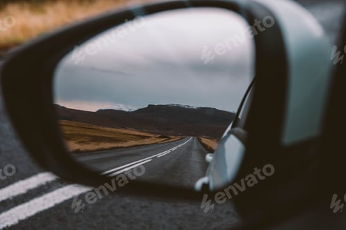 Preview: Scene of adventure travel in the mountains driving a car on the road with clouds and snow.