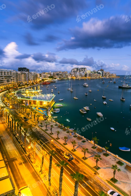 Preview: Evening at Sliema Bay promenade in Malta. Illuminated cityscape