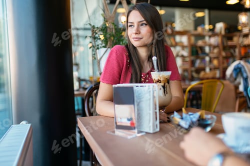 Preview: Beautiful woman talking to friend in restaurant