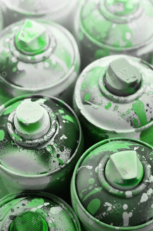 Preview: A lot of used spray cans of paint close-up. Dirty and smeared cans for drawing graffiti.