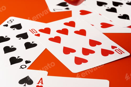 Preview: Playing cards on paper background close up