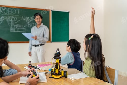 Preview: Group of students learning in a robotics class at elementary school.