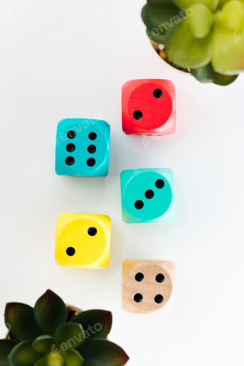 Preview: Closeup of colorful dice on a white background