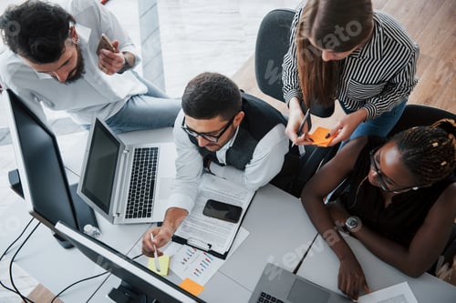 Preview: A group of multinational busy people working in the office
