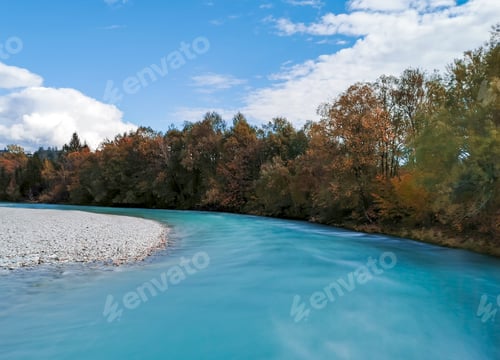 Preview: Long exposure image of blue river and autumn colored trees.