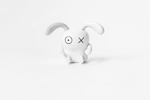 Preview: Figure of a funny white rabbit on a white background.