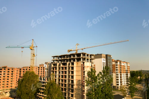 Preview: High multi storey residential apartment buildings under construction. Concrete and brick framing of