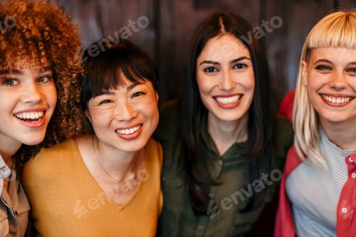 Preview: Four young women smiling and having fun together