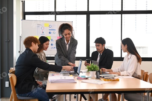 Preview: Group of young smart business people brainstorming, working on new start up project in office.
