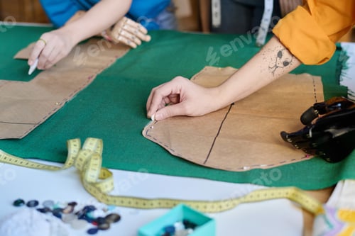 Preview: Girl with Prosthetic Hand Making Clothing Patterns