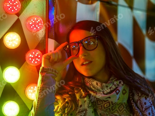 Preview: Stylish young woman near illuminated board